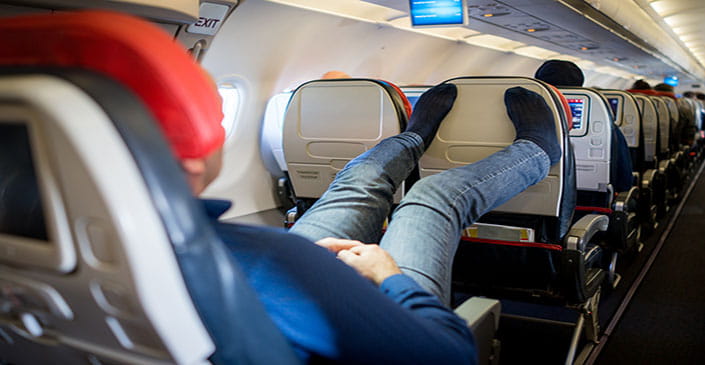 Don’t Put Your Bare Feet on Another Passenger’s Armrest and More Etiquette Tips